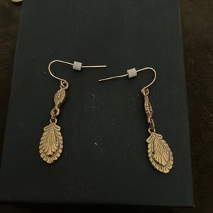 Dangling gold earrings